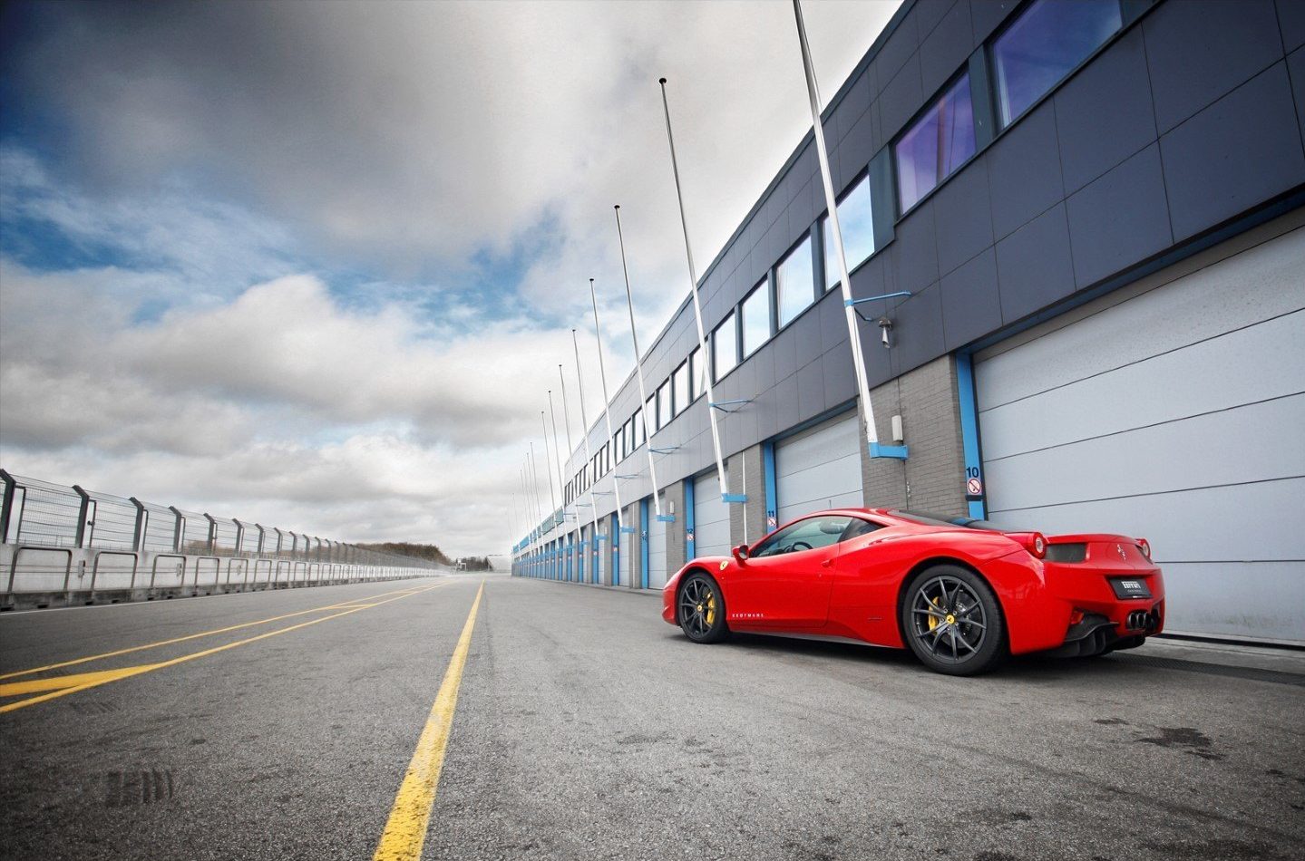 Compact industrial garage doors in the pitlane of TT racetrack