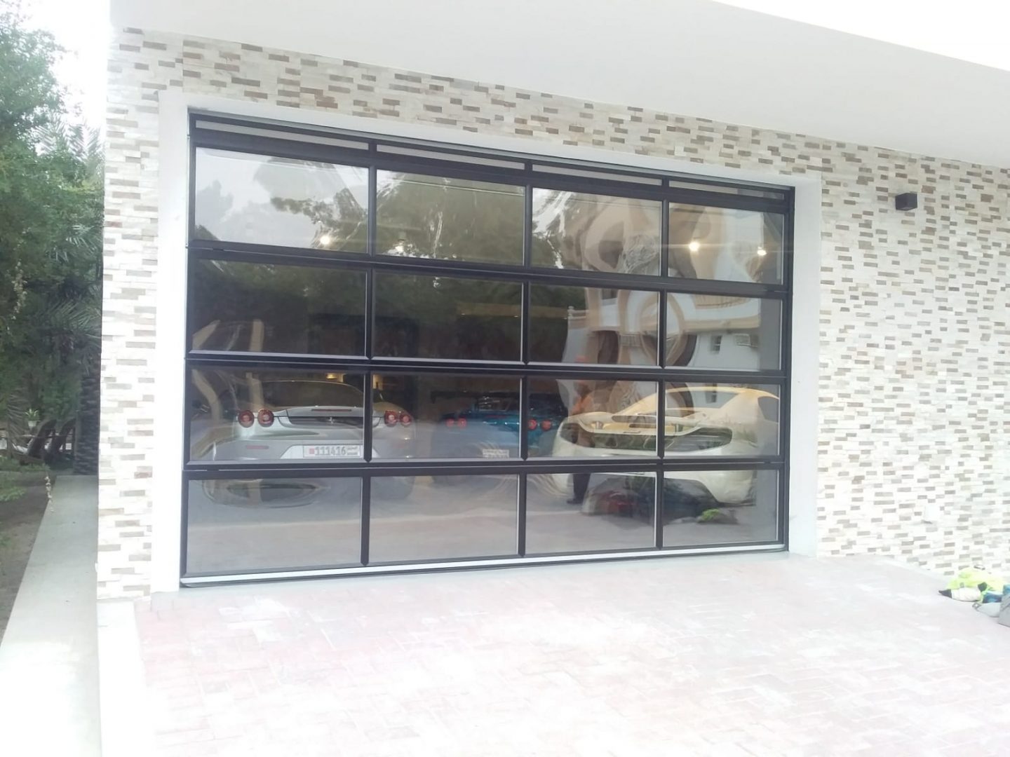Compact garage door with full vision panels