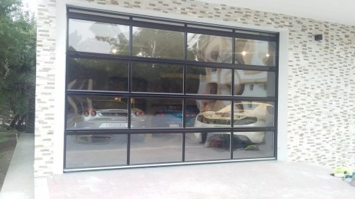 Compact garage door with full vision panels