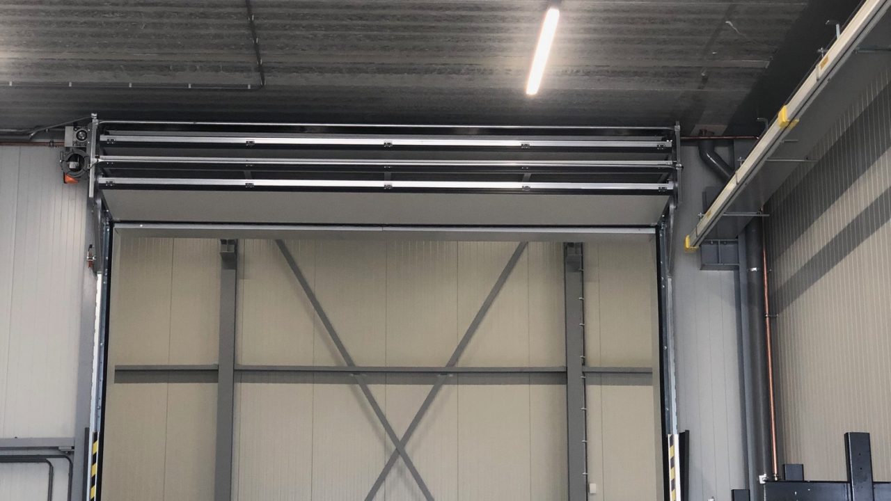 Compact industrial door with lighting