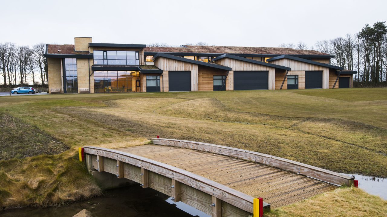 Folding overhead doors at Golf course