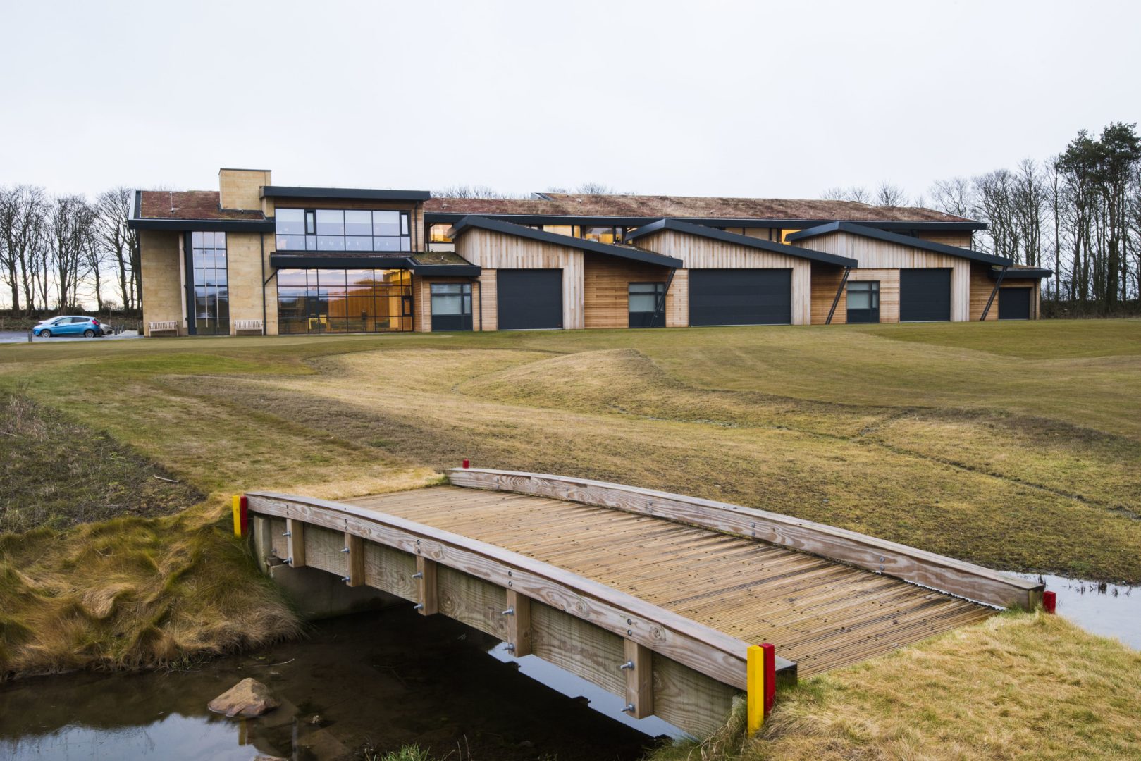 Folding overhead doors at Golf course