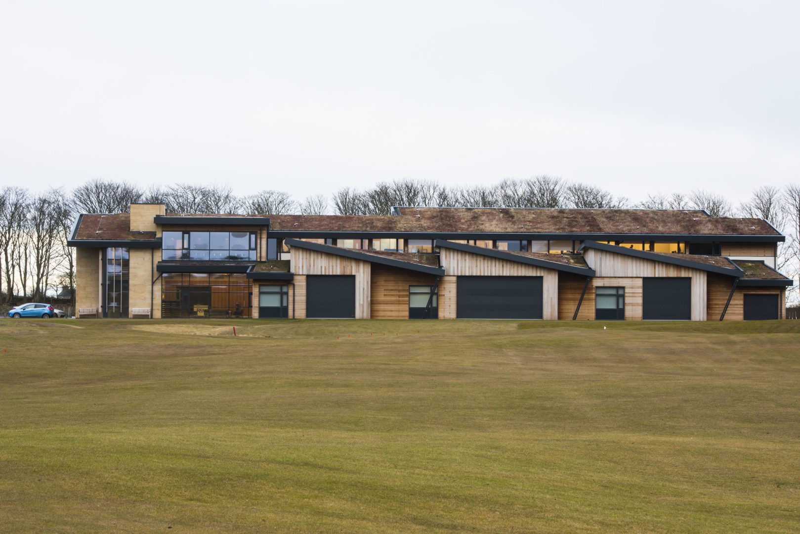 Folding overhead doors for St. Andrews Golf Course in Scotland - Rolflex