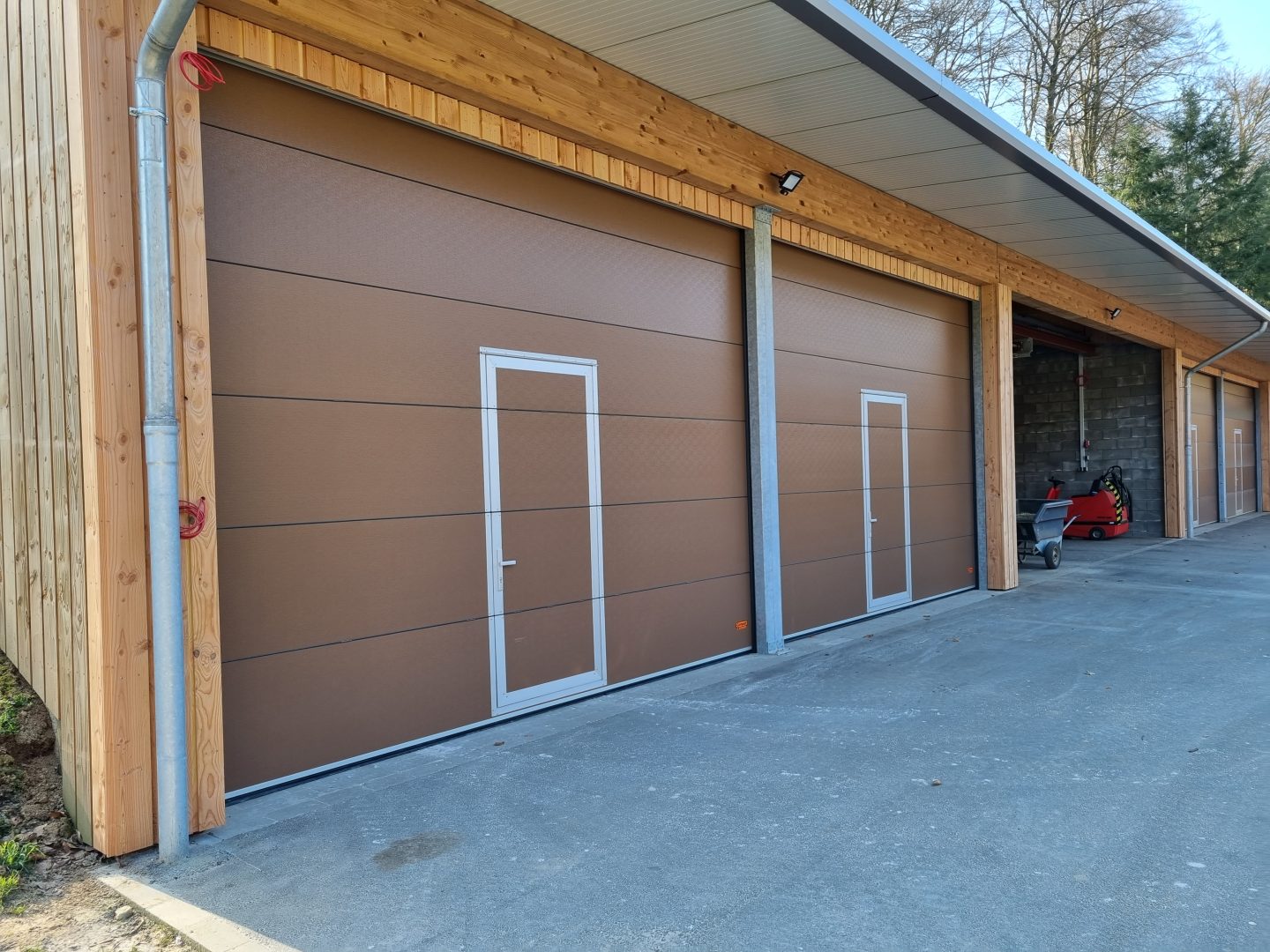 Sectional doors for riding arena