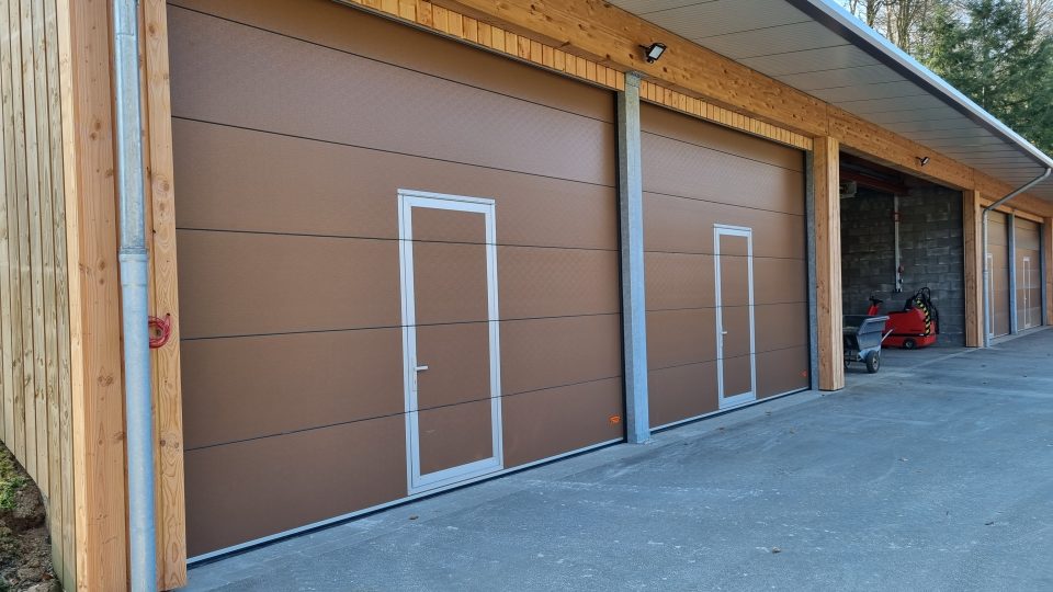Sectional doors for riding arena
