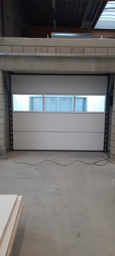 Commercial building with roller shutters