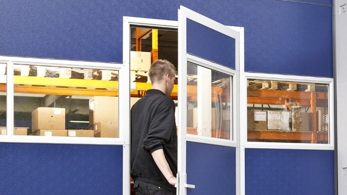 Compact folding door with wicket door