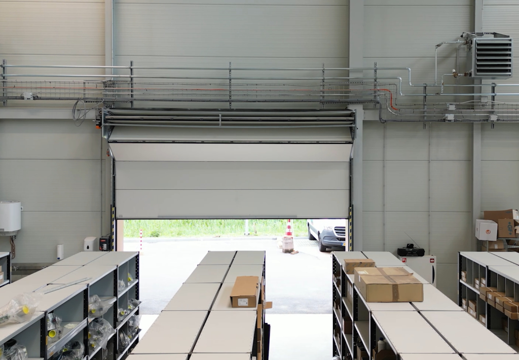 Overhead door without overhead tracks in industrial building